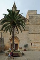 The town of Alcudia in Majorca - The facade of the church of Saint-Jacques. Click to enlarge the image in Adobe Stock (new tab).