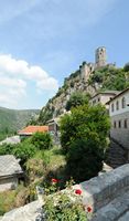 Fortress seen of the village of Pocitelj. Click to enlarge the image in Adobe Stock (new tab).
