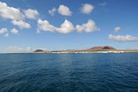 The island of Graciosa to Lanzarote. The village of Caleta del Sebo. Click to enlarge the image in Adobe Stock (new tab).