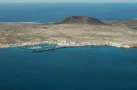 The island of Graciosa to Lanzarote. Caleta del Sebo view from the Mirador del Río. Click to enlarge the image in Adobe Stock (new tab).