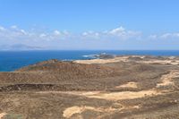 The Los Lobos in Fuerteventura island. Lighthouse Martiño seen from the Caldera. Click to enlarge the image in Adobe Stock (new tab).