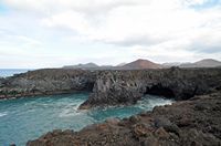 The natural park of los Volcanes in Lanzarote. The Cliffs of Los Hervideros. Click to enlarge the image in Adobe Stock (new tab).