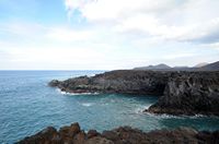 The natural park of los Volcanes in Lanzarote. The Cliffs of Los Hervideros. Click to enlarge the image in Adobe Stock (new tab).