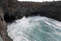The natural park of los Volcanes in Lanzarote. The Cliffs of Los Hervideros. Click to enlarge the image in Adobe Stock (new tab).
