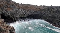 The natural park of los Volcanes in Lanzarote. The Cliffs of Los Hervideros. Click to enlarge the image in Adobe Stock (new tab).