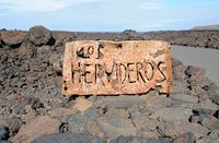 The natural park of los Volcanes in Lanzarote. The Cliffs of Los Hervideros. Click to enlarge the image in Adobe Stock (new tab).