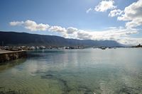 The village of La Caleta de Famara in Lanzarote. The Risco de Famara seen from the port of Caleta del Sebo in La Graciosa. Click to enlarge the image in Adobe Stock (new tab).
