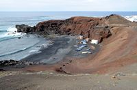 The village of El Golfo in Lanzarote. Fishing boats. Click to enlarge the image in Adobe Stock (new tab).