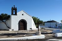 The village of El Mojon in Lanzarote. The Chapel of St. Sebastian. Click to enlarge the image in Adobe Stock (new tab).