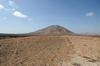 The town of La Oliva in Fuerteventura. La Montaña Tindaya. Click to enlarge the image in Adobe Stock (new tab).