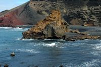 The town of Yaiza in Lanzarote. Dyke of Green Lagoon at El Golfo. Click to enlarge the image in Adobe Stock (new tab).