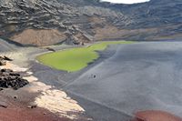 The town of Yaiza in Lanzarote. The Green Lagoon at El Golfo. Click to enlarge the image in Adobe Stock (new tab).