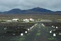 The town of Yaiza in Lanzarote. La bodega El Tablero to Uga. Click to enlarge the image in Adobe Stock (new tab).