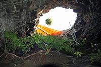 The chasms of Jameos del Agua in Haría in Lanzarote. Hole in the vault. Click to enlarge the image.